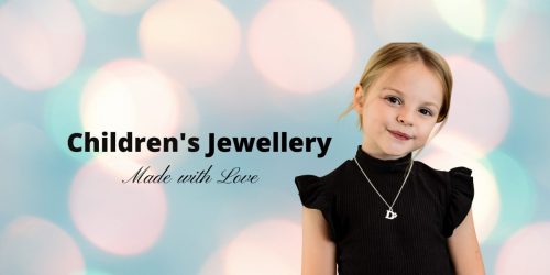 children's jewellery little girl wearing initial necklace